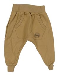 Béžové tepláky s klokankou