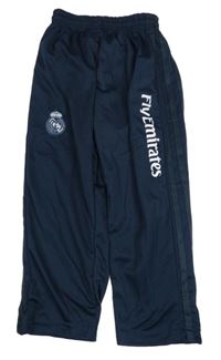 Tmavomodré sportovní tepláky s nápisem