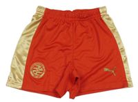 Červeno-zlaté sportovní kraťasy s logem Puma