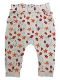 Biele ľahké baggy tepláky s kvietkami a jahůdkami Topomini