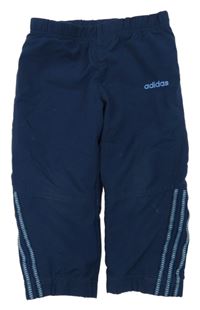 Tmavomodré šušťákové nohavice Adidas
