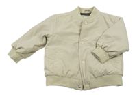 Béžový šusťákový zateplený bomber so smajlíkom Primark