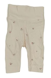 Smetanové tepláky s kytičkami H&M