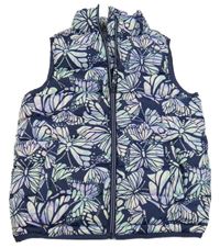 Tmavomodrá šušťáková prešívaná zateplená funkčná vesta s motýly Mountain Warehouse