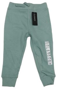 Nové - olivovošedé tepláky se smajlíkem St. Bernard