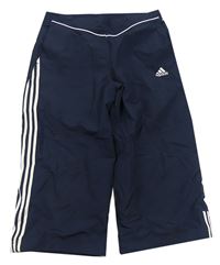 Tmavomodré capri šušťákové športové nohavice Adidas
