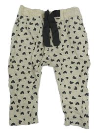 Béžovo-černé lehké tepláky se srdíčky Dopodopo