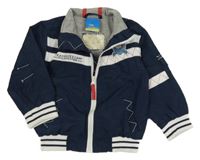 Tmavomodro-biela šušťáková jarná bunda s pirátem Topolino