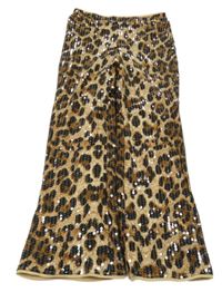 Hnedé vzorované flitrové flare podšité nohavice River Island