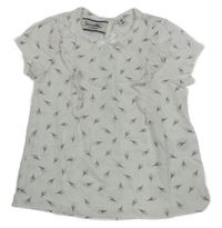 Bílé tričko s kytičkami a volánky Sanetta