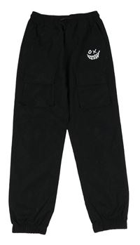 Čierne šušťákové cuff nohavice s vreckami a smajlíkom