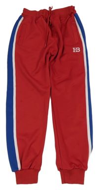 Červené športové tepláky s modrým pruhom