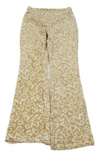 Béžovo-smotanové plyšové flare legíny so srdiečkami Y.F.K.