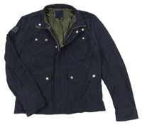 Tmavomodrá šusťáková jarní bunda s kapsami 