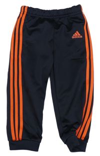 Tmavomodro-oranžové sportovní tepláky s logem Adidas