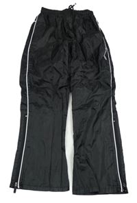 Čierno-biele šušťákové funkčné nohavice Stanno