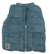 Tmavomodrá šušťáková zateplená vesta s nášivkou Nutmeg