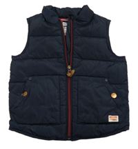 Tmavomodrá šušťáková zateplená vesta zn. Next