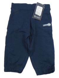 Nové - tmavomodré tepláky Champion