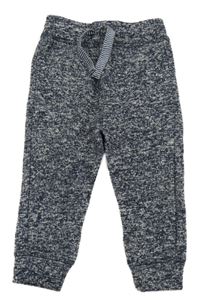 Tmavomodré melírované úpletové tepláky Tu