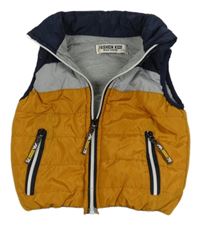 Okrovo-tmavomodro-sivá šušťáková prešívaná zateplená vesta