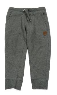 Tmavosivé melírované tepláky s nášivkou Staccato