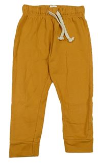 Okrové tepláky hema