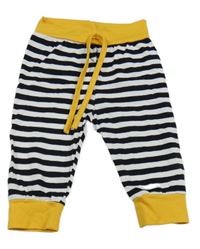 Bielo-čierno-žlté pruhované tepláky