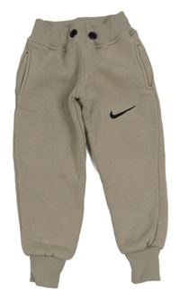 Béžové tepláky Nike