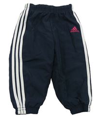 Tmavomodré šušťákové športové nohavice Adidas