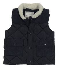 Tmavomodrá prešívaná šusťákovo/manšestrová zateplená vesta Matalan