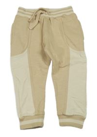 Béžovo-světlebéžové melírované tepláky s pruhy St. Bernard