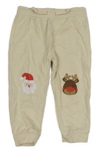 Béžové tepláky so sobom a Santou