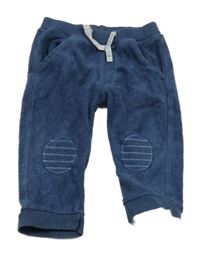 Tmavomodré zamatové tepláky s nášivkami