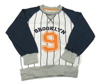 Bielo-tmavomodrá mikina s číslom a pruhmi