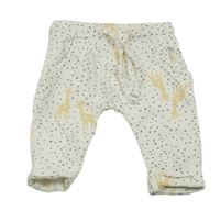 Smetanové puntíkaté lehké tepláky s žirafami Prénatal