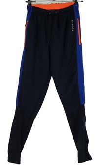 Pánské tmavomodro-modré sportovní funkční tepláky Kipsta vel. 32