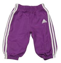 Fialové šušťákové podšité nohavice s logom Adidas