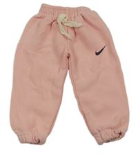 Růžové tepláky Nike