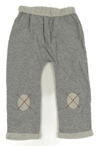 Sivé melírované baggy tepláky s nášivkami na kolenou