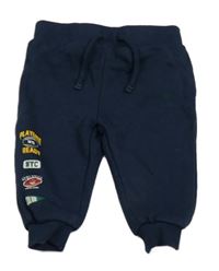 Tmavomodré tepláky s potlačou Primark