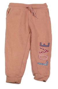 Světleskořicové tepláky s nápisom lupilu