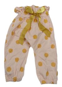 Růžové lehké tepláky se zlatými puntíky a mašlí 