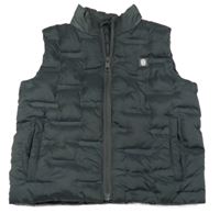 Tmavosivá šušťáková prešívaná zateplená vesta s nášivkou