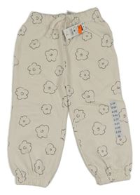 Nové - Smetanové tepláky s kytičkami Dunnes