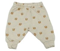 Světlebéžové, melírované tepláky s kvietkami PUSBLU