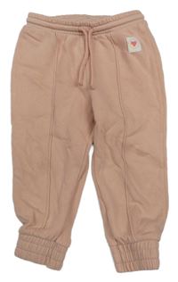 Pudrové tepláky s nášivkou H&M