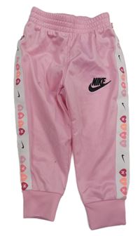 Růžové sportovní tepláky s logem Nike