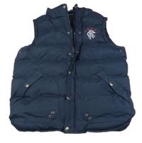 Tmavomodrá šušťáková zateplená vesta s výšivkou