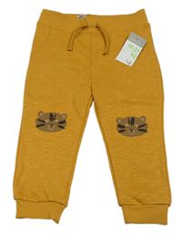 Okrové tepláky s tigrami Primark